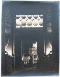 Arch looking through to the Court of the Universe at night